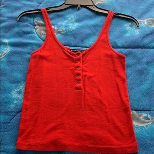 A red tank top from Brandy Melville